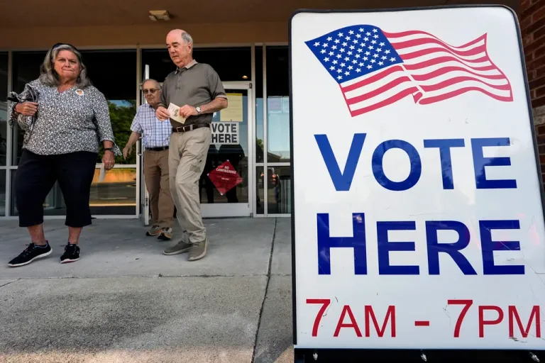 Voters depart an election center during primary voting, May 21, 2024, in Kennesaw, Georgia. Conservative groups are systematically attempting to challenge large numbers of voter registrations across the country ahead of this year's presidential election.