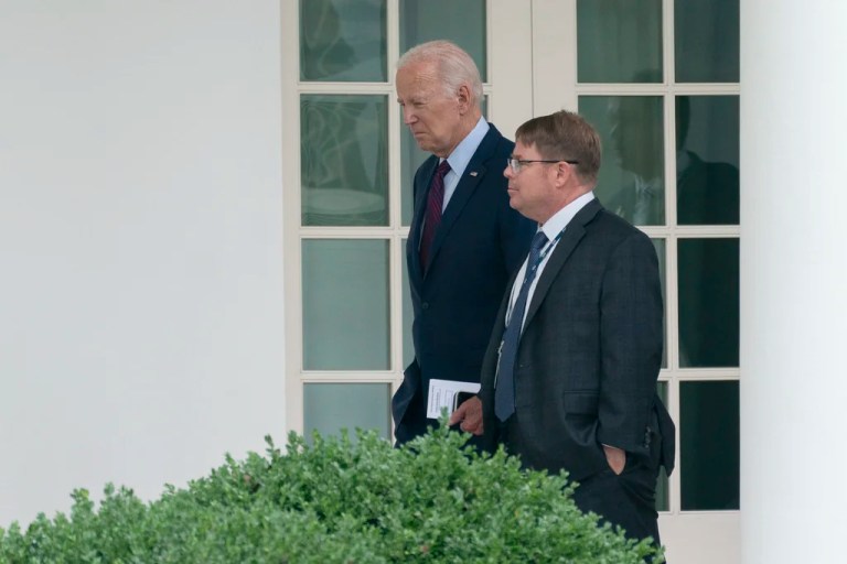 President Joe Biden walks along the Colonnade at the White House with his physician Kevin O'Connor, Monday, Aug. 28, 2023. (AP Photo/Manuel Balce Ceneta)