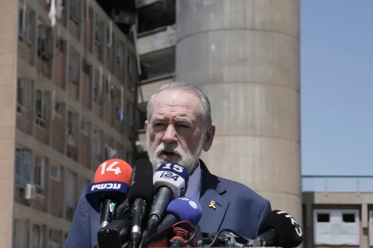 U.S. Ambassador to Israel Mike Huckabee in front of microphones.