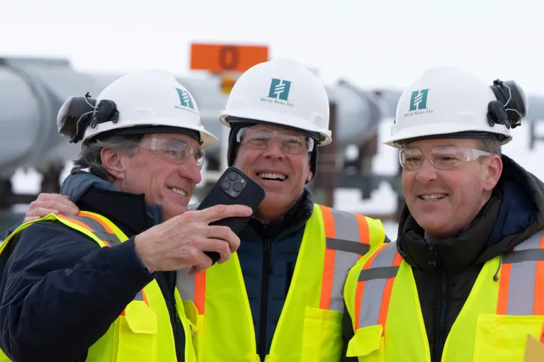 From left, Interior Secretary Doug Burgum, Energy Secretary Chris Wright, and Environmental Protection Agency Administrator Lee Zeldin smile after posing for a photo with the Trans-Alaska Pipeline in the background after a news conference at the Pump Station 1 on Monday, June 2, 2025, located near Deadhorse, Alaska, on the state's prodigious North Slope.