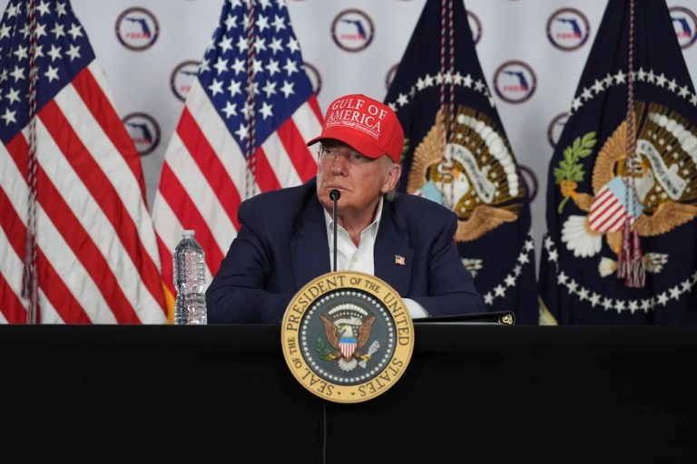 President Donald Trump listens during a roundtable at 