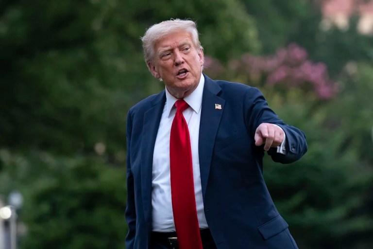 President Donald Trump talks to reporters as he walks on the South Lawn upon arriving at the White House, Sunday, July 13, 2025, in Washington. (AP Photo/Jose Luis Magana)