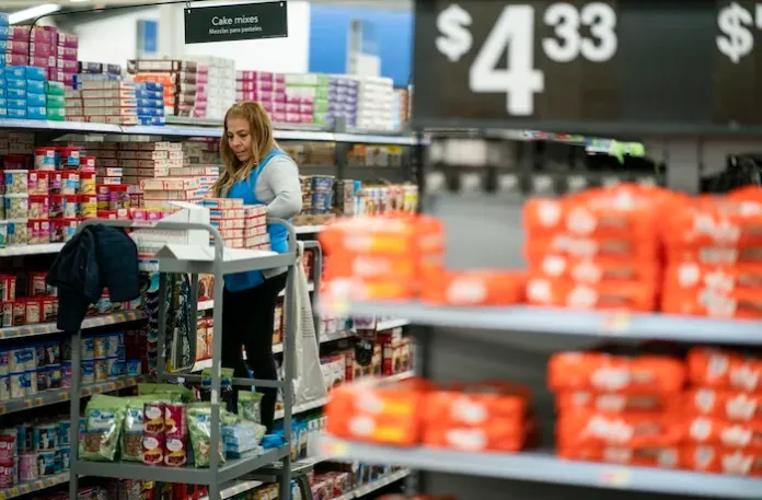 FILE - A worker organizes items at a Walmart Supercenter in North Bergen, N.J.,