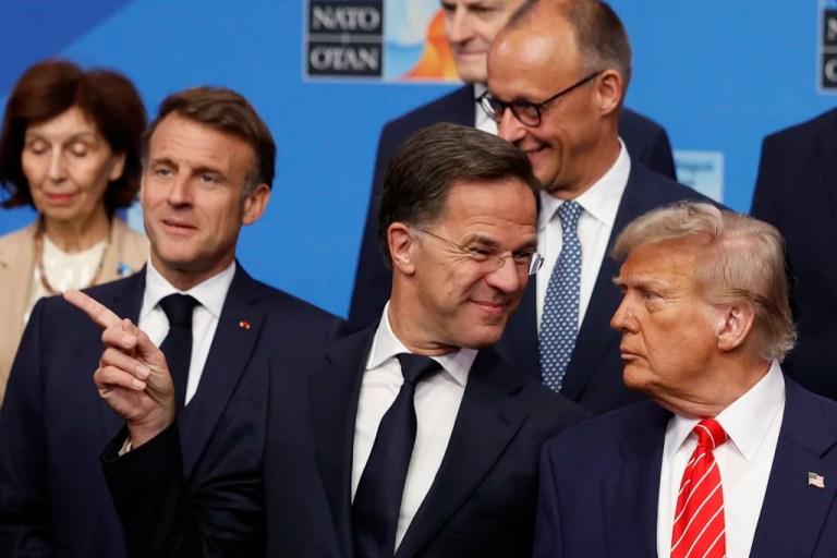 President Donald Trump, right, speaks with NATO Secretary General Mark Rutte during a group photo of North Atlantic Treaty Organization heads of state and government at the NATO summit in The Hague, Netherlands, Wednesday, June 25, 2025.