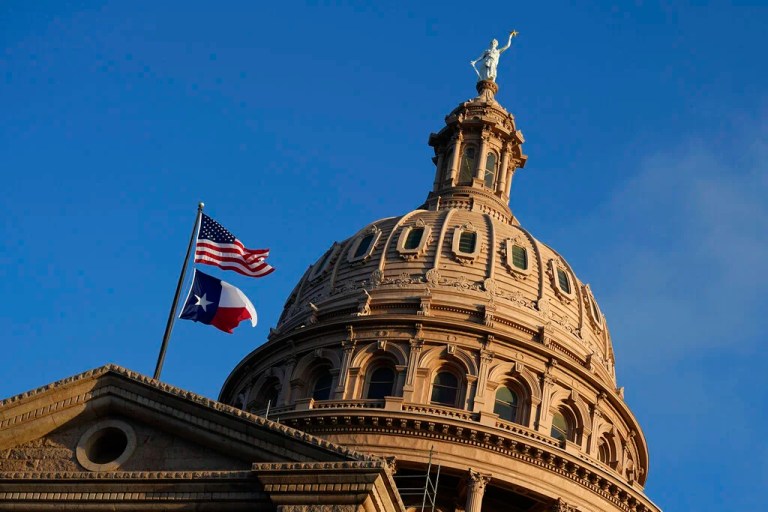 The U.S. and Texas flags fly over the Texas Capitol during the first day of the 88th Texas Legislative Session in Austin, Texas, Tuesday, Jan. 10, 2023.