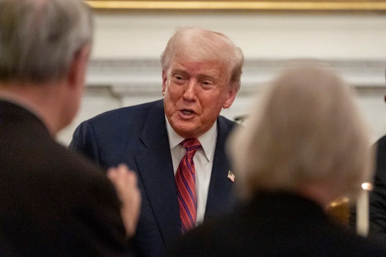 President Donald Trump greets supporters during a dinner for Republican senators in the State Dining Room of the White House, Friday, July 18, 2025, in Washington.