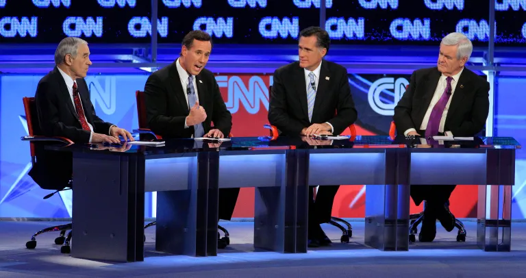 In this Feb. 22, 2012 file photo, Republican presidential candidates, from left, Rep. Ron Paul, R-Texas, former Pennsylvania Sen. Rick Santorum, former Massachusetts Gov. Mitt Romney and former House Speaker Newt Gingrich share the stage during a Republican presidential debate in Mesa, Ariz.