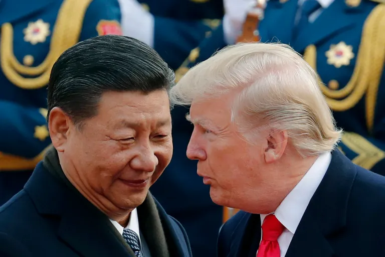 President Donald Trump talks with Chinese President Xi Jinping