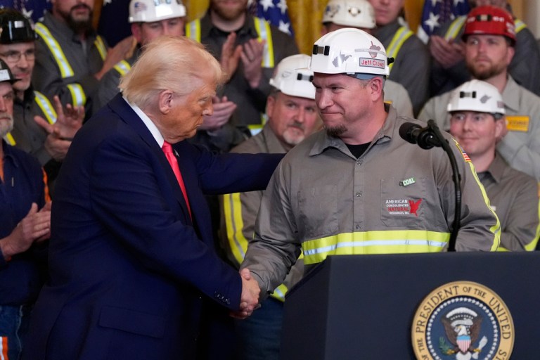 President Donald Trump shakes hands with coal miner Jeff Crowe during an event on energy production in the East Room of the White House, Tuesday, April 8, 2025, in Washington.