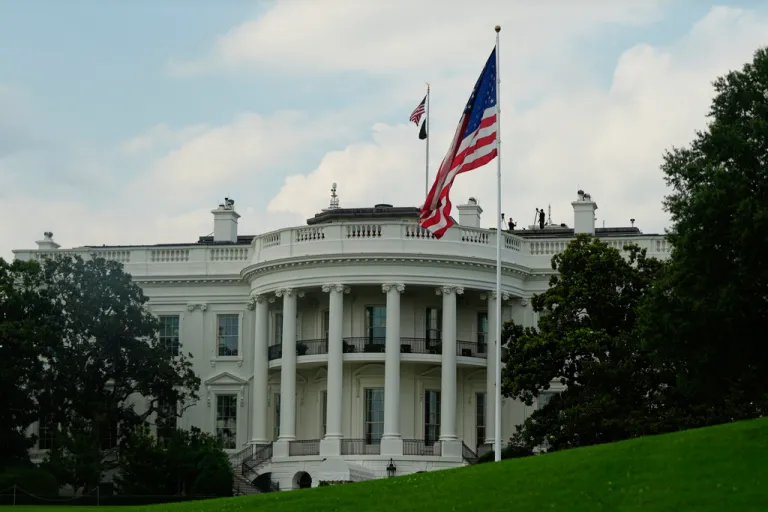 The large American flags flies on the South Lawn of the White House before President Donald Trump departs the White House for an AI summit at the Andrew W. Mellon Auditorium, Wednesday, July 23, 2025, in Washington. (AP Photo/Julia Demaree Nikhinson)