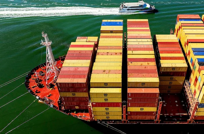 Cargo containers fill a ship at the Port of Oakland on Wednesday