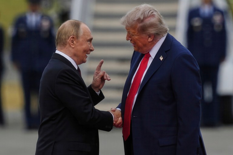 President Donald Trump greets Russian President Vladimir Putin on Friday, Aug. 15, 2025, at Joint Base Elmendorf-Richardson, Alaska.