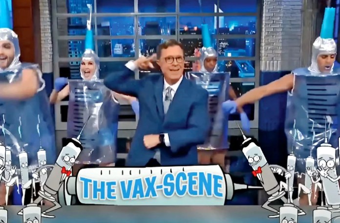 Above, host Stephen Colbert with dancers dressed as COVID vaccine needles in September 2021. (CBS, via YouTube)