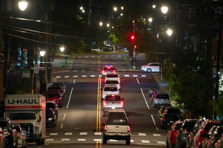 Vehicles with law enforcement agents from the U.S. Customs and Border Protection as well as Metropolitan Police drive along Kennedy Street NW, in the early morning of Wednesday, Aug. 13, 2025, in Petworth neighborhood of Washington. (AP Photo/Jacquelyn Martin)