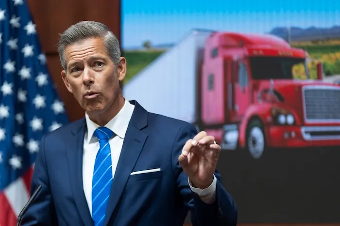 Transportation Secretary Sean Duffy, speaks during a news conference at the U.S. Department of Transportation headquarters, announcing formal action against three states for failing to enforce federal English Language Proficiency (ELP) requirements for commercial motor vehicle drivers, Tuesday, Aug. 26, 2025, in Washington. (AP Photo/Manuel Balce Ceneta)