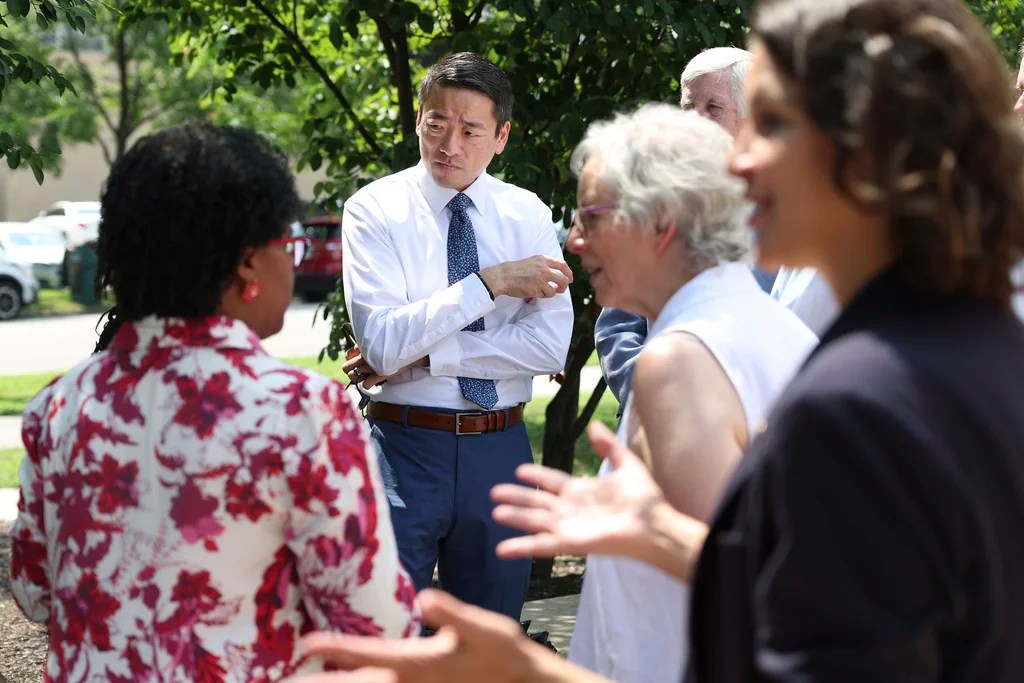 Texas State Rep. Gene Wu, D-Houston, center, talks to Democrat politicians from Indiana, in Chicago, Wednesday, Aug. 13, 2025, before other Texas politicians arrive for a press conference as the Texas Democrats continue to try to prevent a redistricting effort by Republicans in their state.