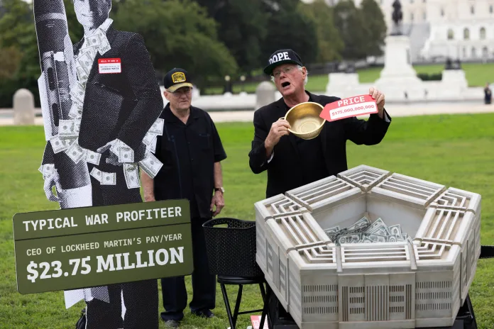 Ben Cohen shows price tags of everyday items, highlighting "wasteful" Pentagon spending. (Graeme Jennings / Washington Examiner)
