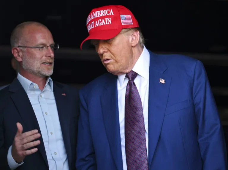 President-elect Donald Trump speaks with talks with Brendan Carr before the launch of the sixth test flight of the SpaceX Starship rocket Tuesday, Nov. 19, 2024 in Boca Chica, Texas.