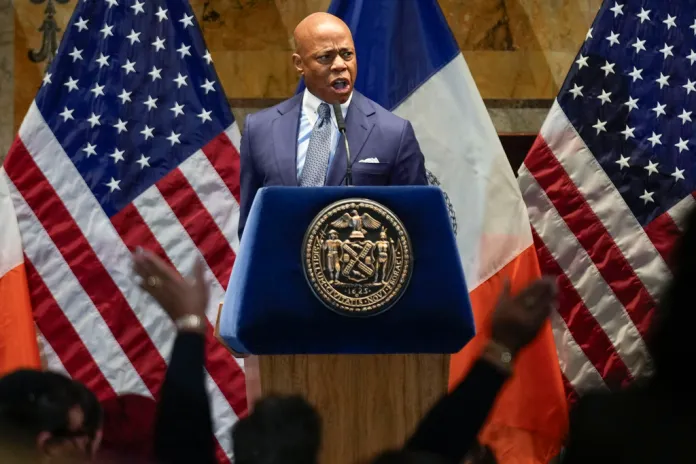 A supportive crowd reacts as New York City mayor Eric Adams speaks during an interfaith breakfast event.