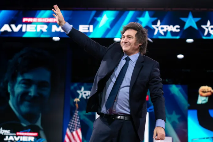Argentina's President Javier Milei waves to the crowd before speaking at the Conservative Political Action Conference, CPAC, at the Gaylord National Resort & Convention Center, Saturday, Feb. 22, 2025, in Oxon Hill, Md.