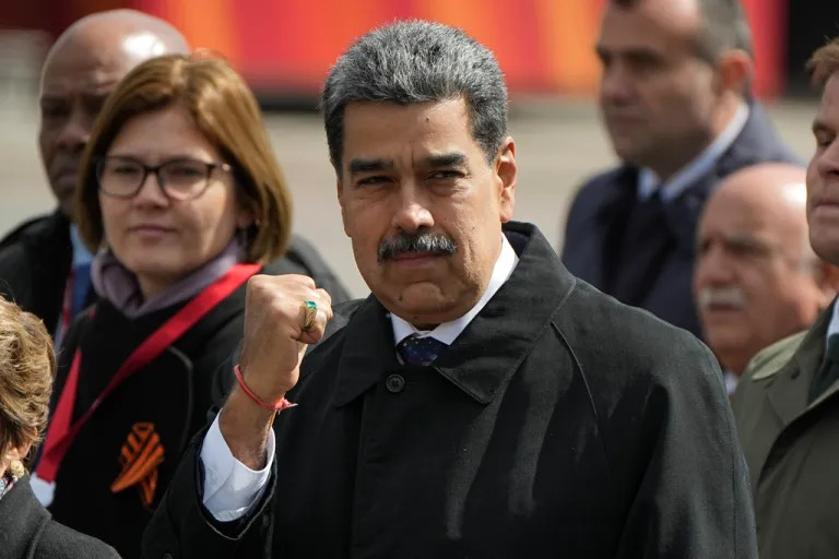 Venezuela's President Nicolas Maduro gestures as he walks in Red square after the Victory Day military parade in Moscow, Russia, Friday, May 9, 2025, during celebrations of the 80th anniversary of the Soviet Union's victory over Nazi Germany during the World War II. (AP Photo/Pavel Bednyakov, Pool)