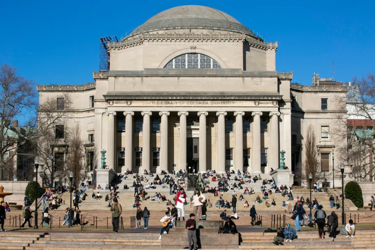 FILE - Students sit on the front steps of Low Memorial Library on the Columbia University campus in New York City, Feb. 10, 2023.