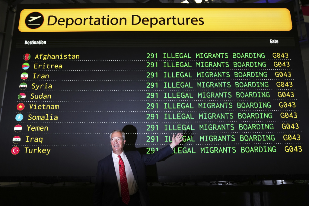 Reform UK leader Nigel Farage poses in front of a mock departures board.