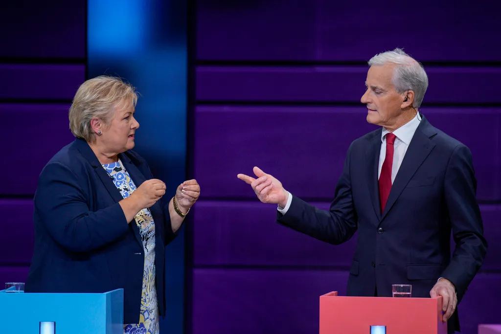 Erna Solberg, chairwoman of Norway's Hoyre party, and Jonas Gahr Store, chairman of Norway's Ap party, during a TV debate in Oslo, Norway, Tuesday, Sept. 2, 2025.