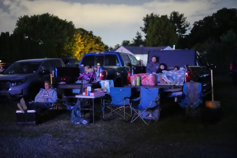 Drive-in movie goers watch 