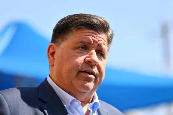 Gov. JB Pritzker (D-IL) speaks with reporters after visiting Prairie Oak Elementary School.
