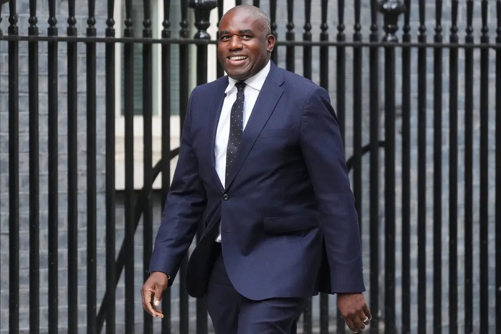 Newly appointed Justice Secretary and Deputy Prime Minister, David Lammy, arrives in Downing Street, London, where Prime Minister Keir Starmer is reshuffling his Cabinet following the resignation of Angela Rayner, Friday, Sept. 5, 2025. (James Manning/PA via AP)