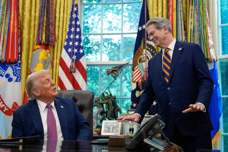 Treasury Secretary Scott Bessent gestures as President Donald Trump speaks in the Oval Office.