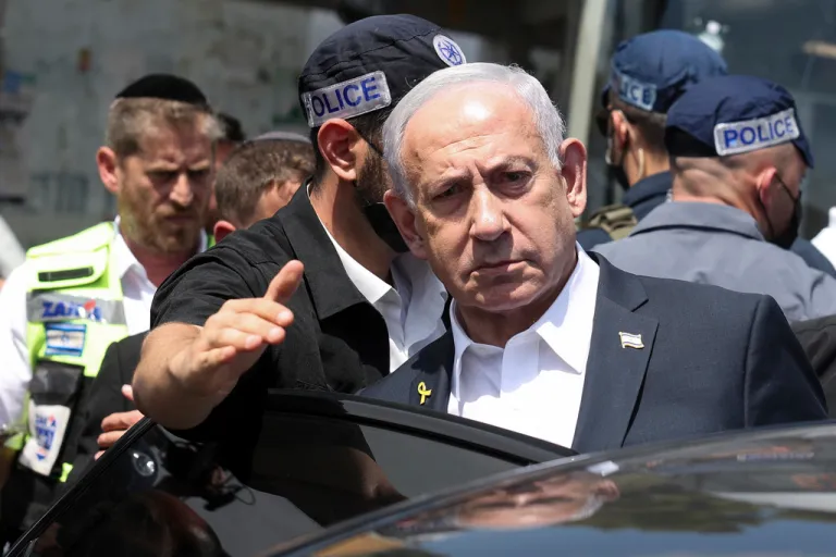Israel's Prime Minister Benjamin Netanyahu visits the site of a shooting attack at a bus stop in Jerusalem, Monday, Sept. 8, 2025.