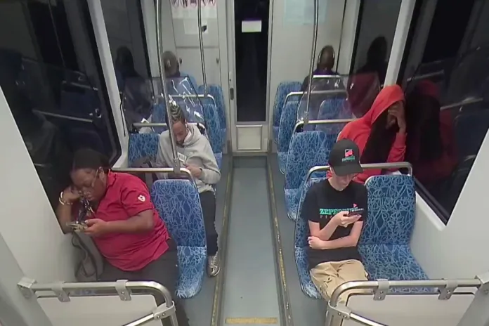 This screengrab made from video provided by the Charlotte Area Transit System shows Iryna Zarutska, bottom right, before she was fatally stabbed on a commuter train on Aug. 22, 2025.