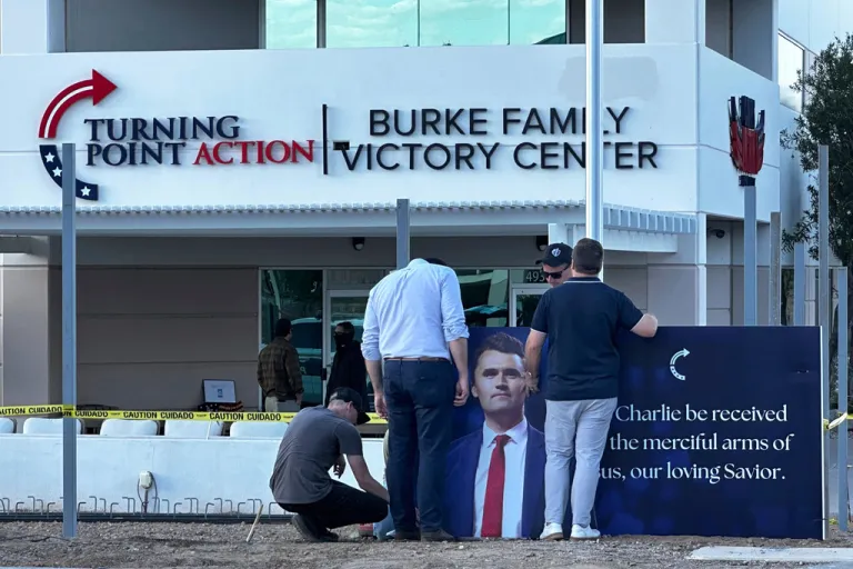 A large banner that reads “May Charlie be received into the merciful arms of Jesus, our loving Savior,” is installed outside the Turning Point USA headquarters in Phoenix, Wednesday, Sept. 10, 2025.