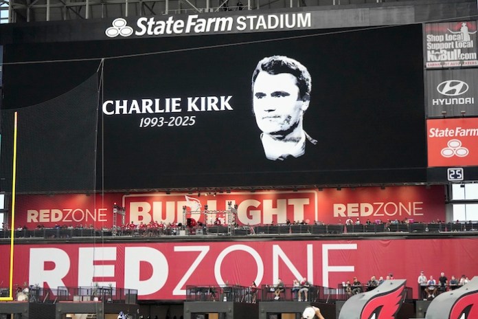The scoreboard displays the likeness of Charlie Kirk prior to an NFL football game between the Carolina Panthers and the Arizona Cardinals.