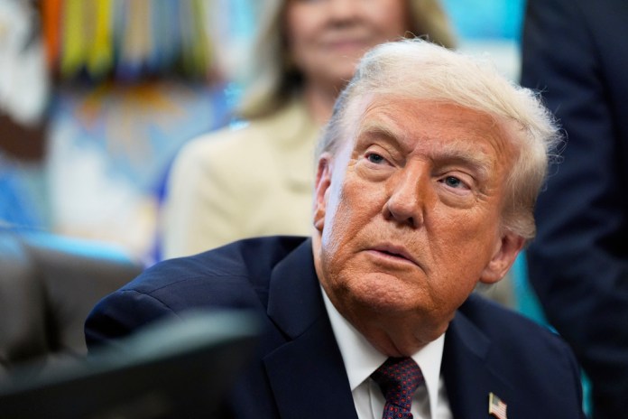 President Donald Trump speaks in the Oval Office.