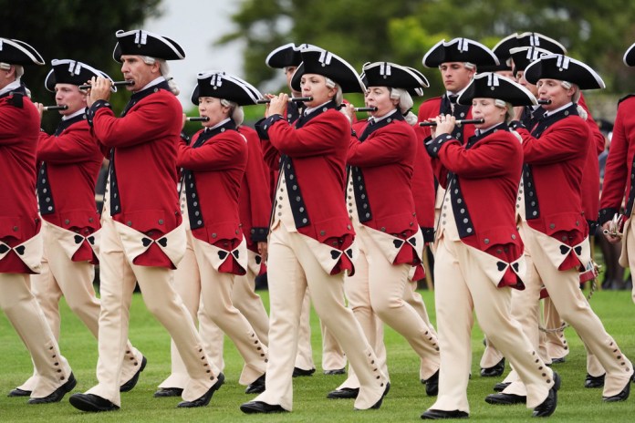 Musicians play during a Beating Retreat musical performance on the East Lawn of Windsor Castle, in Windsor, England, Wednesday, Sept. 17, 2025.