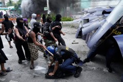 Dozens arrested and hurt in clashes with police near Philippine presidential palace