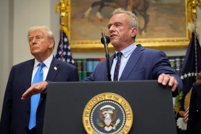 President Donald Trump listens as Health and Human Services Secretary Robert F. Kennedy Jr., speaks in the Roosevelt Room of the White House, Monday, Sept. 22, 2025, in Washington. 