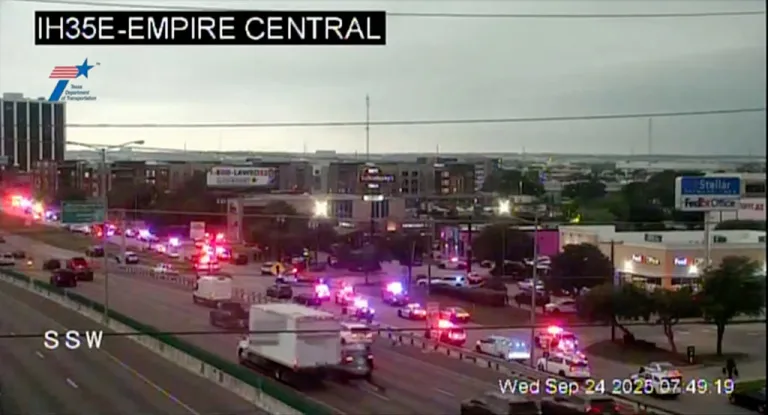 This traffic camera image shows heavy police presence off I-35E close to a U.S. Immigration and Customs Enforcement office, in northwest Dallas on Thursday, Sept. 24, 2025.