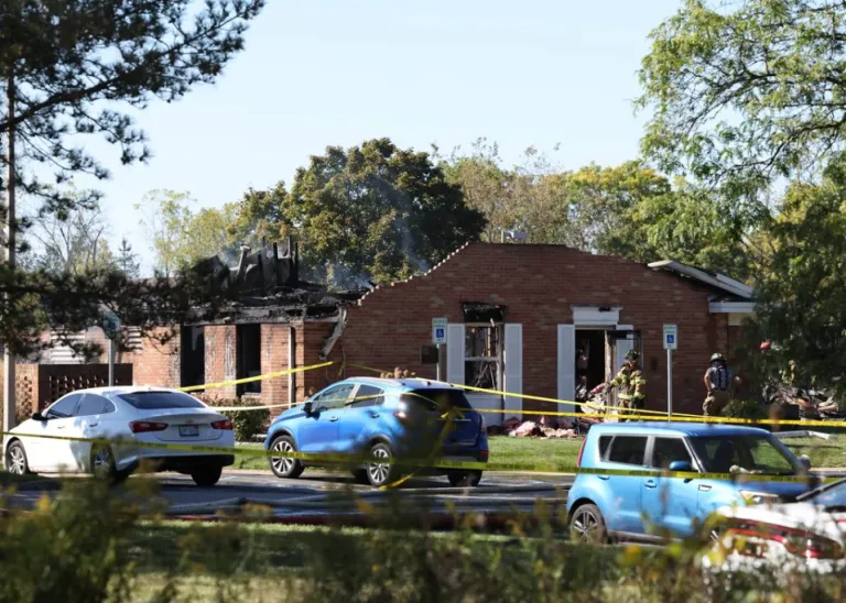 Fire and law enforcement officers stand outside a Church of Jesus Christ of Latter-day Saints.