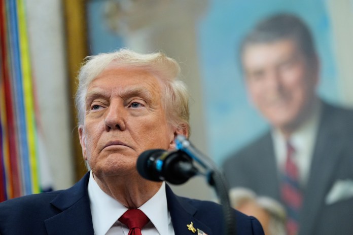 President Donald Trump speaks in the Oval Office of the White House, Tuesday, Sept. 30, 2025, in Washington.