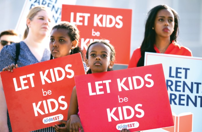 Demonstrators are seen outside the Supreme Court as oral arguments are heard in Mahmoud v. Taylor on Tuesday, April 22, 2025. (Tom Williams/CQ-Roll Call, Inc/Getty Images)