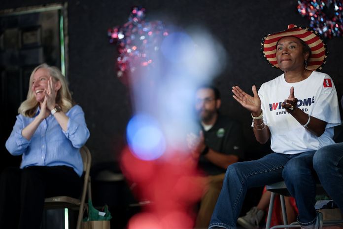 Virginia Republican gubernatorial candidate, Lt. Gov. Winsome Earle-Sears (R), and Virginia Democratic gubernatorial candidate, former Rep. Abigail Spanberger (L), wait to speak at the 54th Annual Buena Vista Labor Day Festival on September 01, 2025 in Buena Vista, Virginia. The Commonwealth of Virginia will hold its off-year election for governor and other statewide offices on November 4. (Photo by Win McNamee/Getty Images)