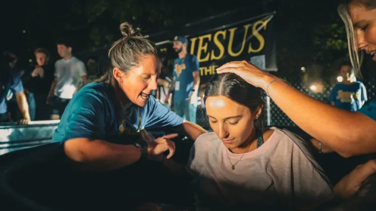 A University of Pittsburgh student is baptized at Pitt for Purpose.