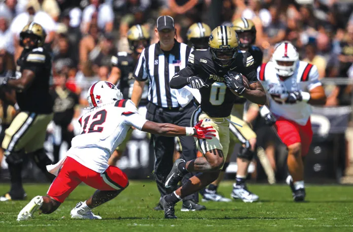 Purdue wide receiver Nitro Tuggle (0) runs past Ball State University defensive back Deondre Shepherd (12) during a game on Aug. 30 in West Lafayette, Indiana.(Zach Bolinger/Icon Sportswire via Getty Images)