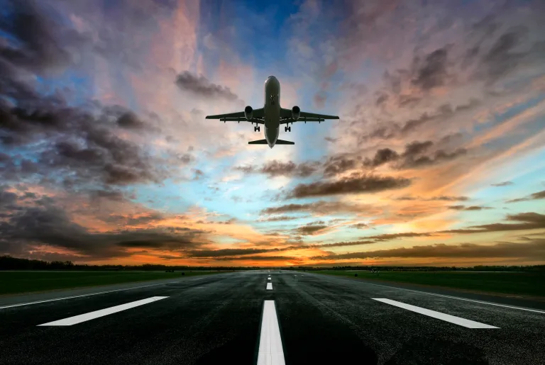 Passenger airplane taking of at sunrise.
