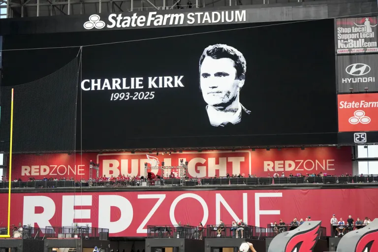 The scoreboard displays the likeness of Charlie Kirk prior to an NFL football game between the Carolina Panthers and the Arizona Cardinals, Sunday, Sept. 14, 2025, in Glendale, Ariz. (AP Photo/Rick Scuteri)