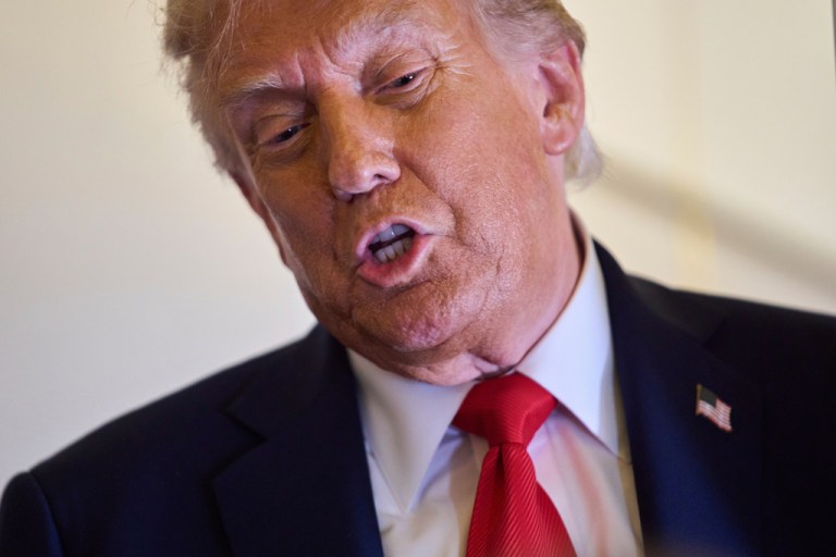 President Donald Trump speaks with reporters.